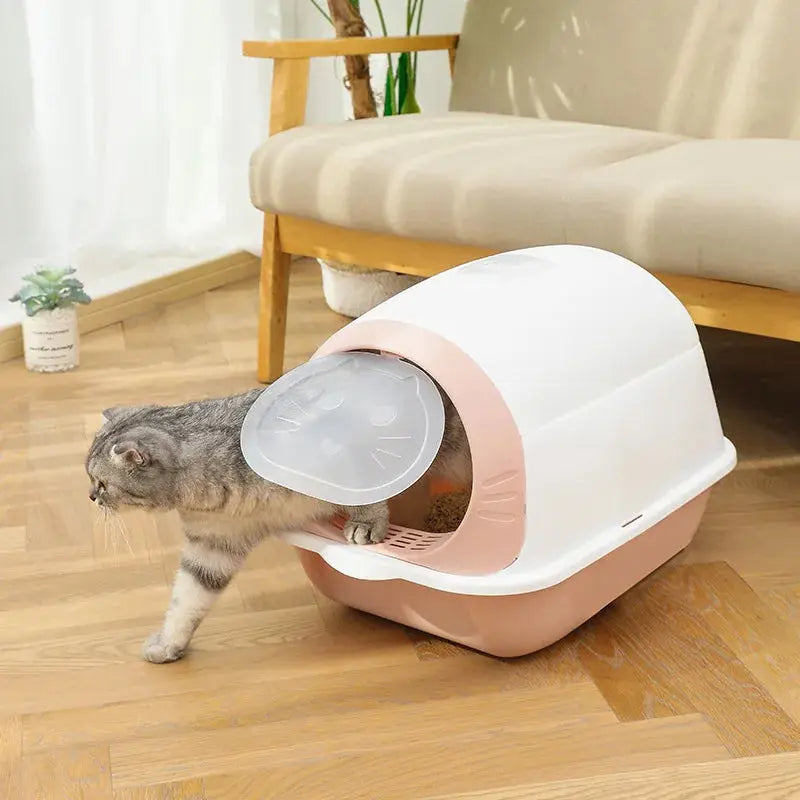Maison de toilette arrondie pour chat avec porte battante design
