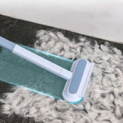 Brosse antipeluches avec manche gris et bleu – Design ajustable et pratique