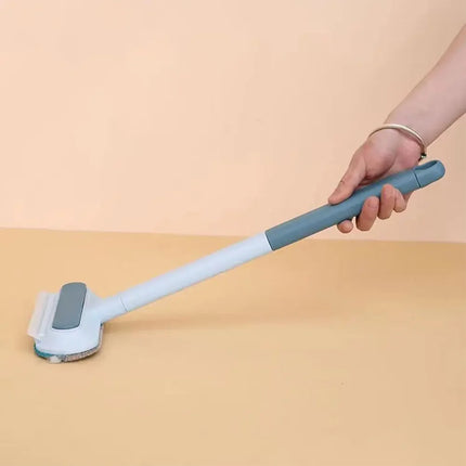 Brosse antipeluches avec manche gris et bleu – Design ajustable et pratique